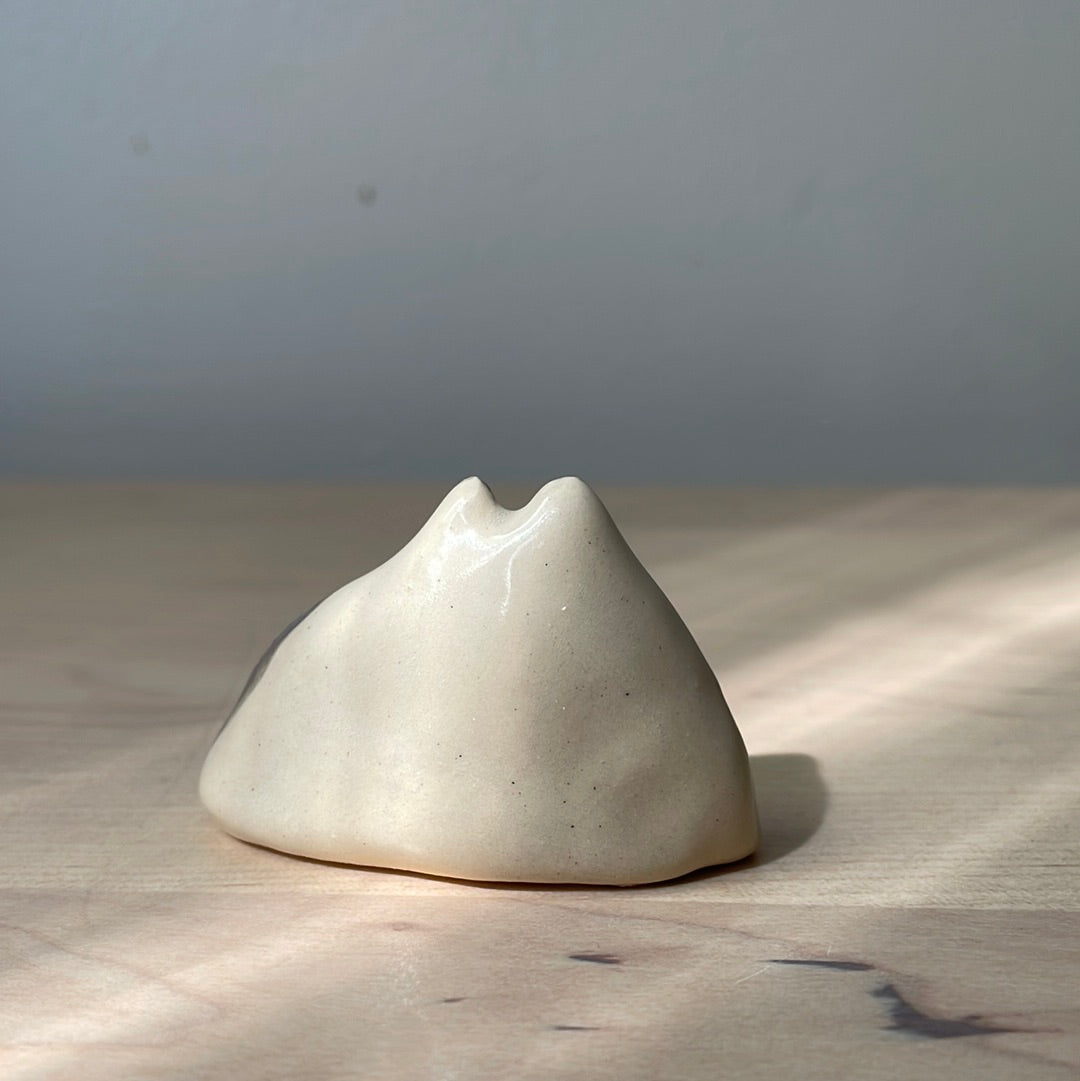 Ceramic: Black and white cat with black tail