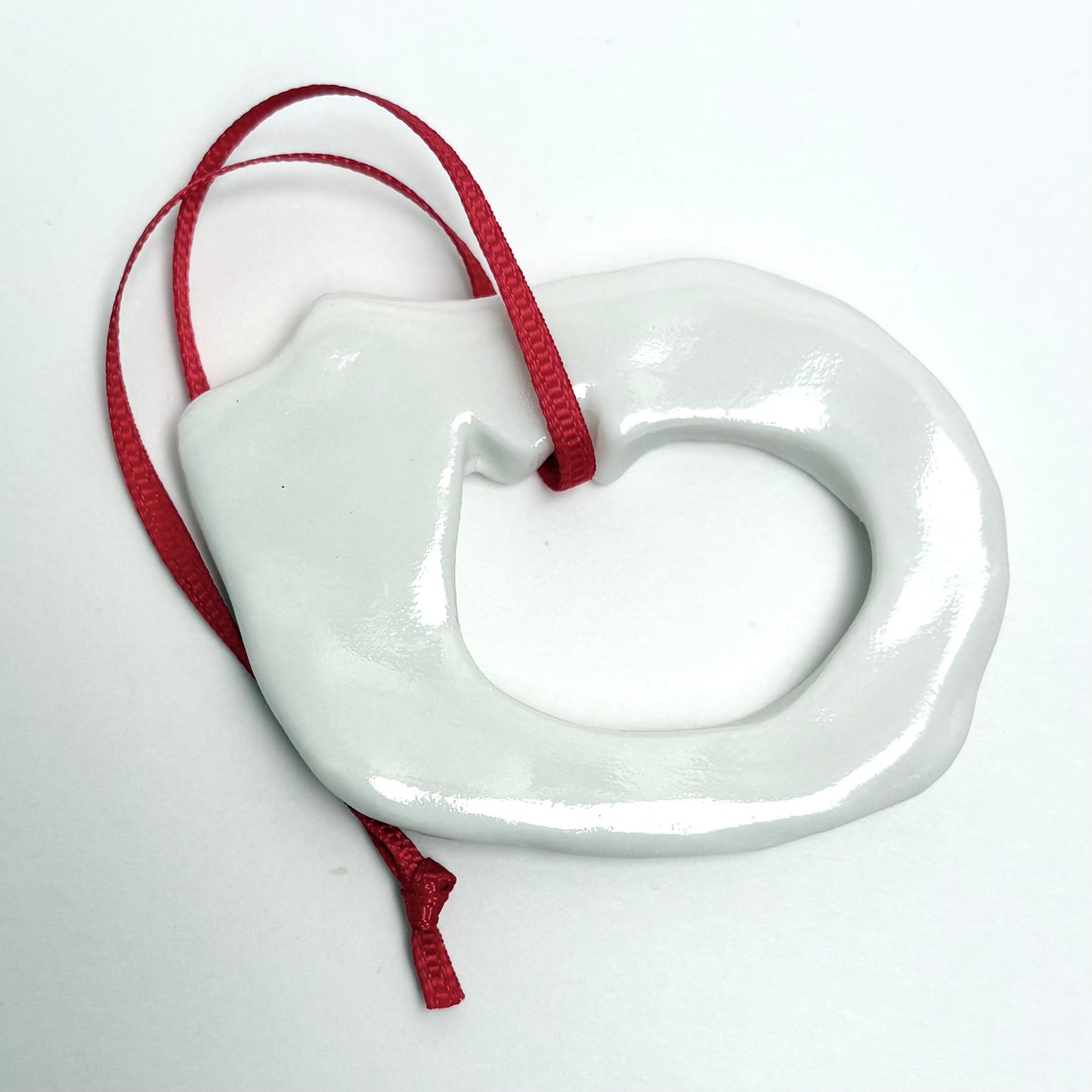 Handmade Porcelain Cat Christmas Ornament with Cutout, White Glazed Ceramic Holiday Decoration with Red Ribbon, Minimalist Winter Decor