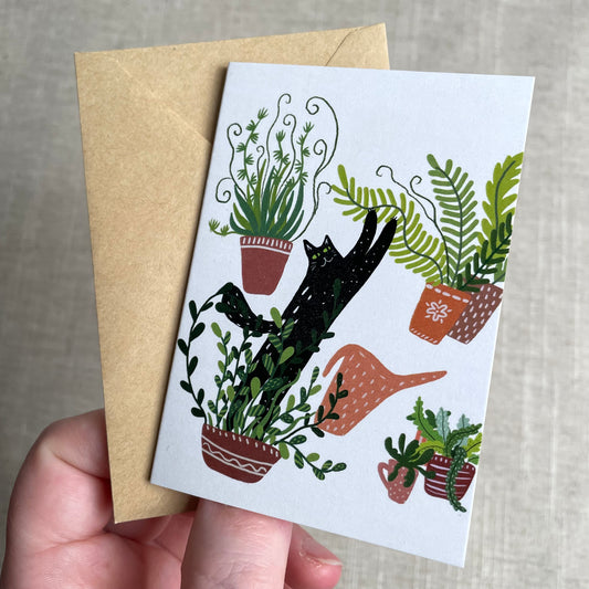Mini carte : Chat noir parmi les plantes