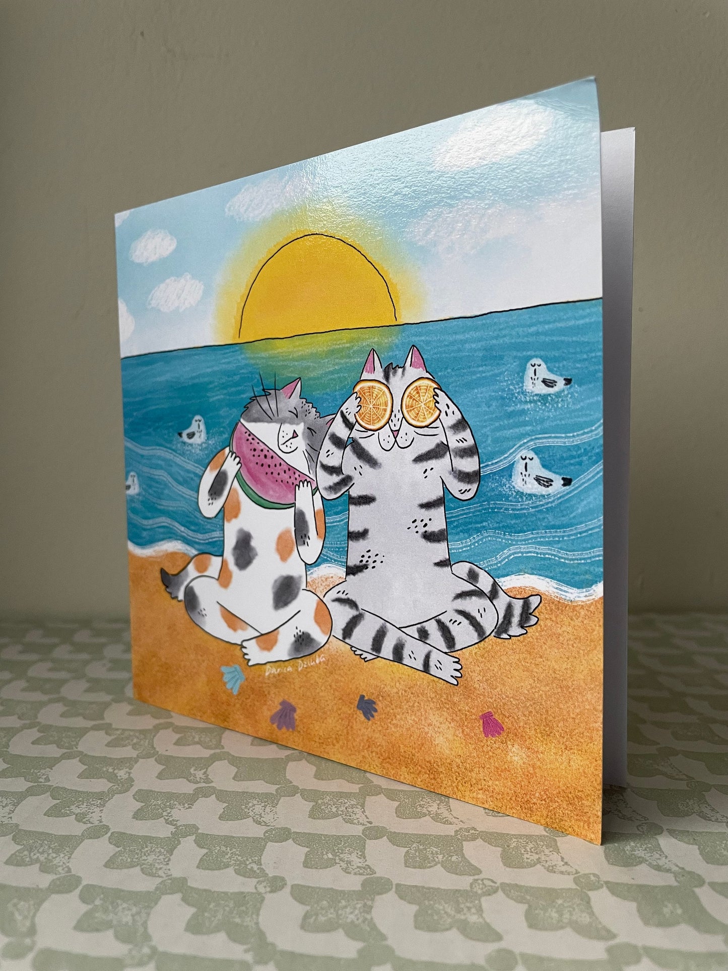 Cat friends at a beach: Greeting card