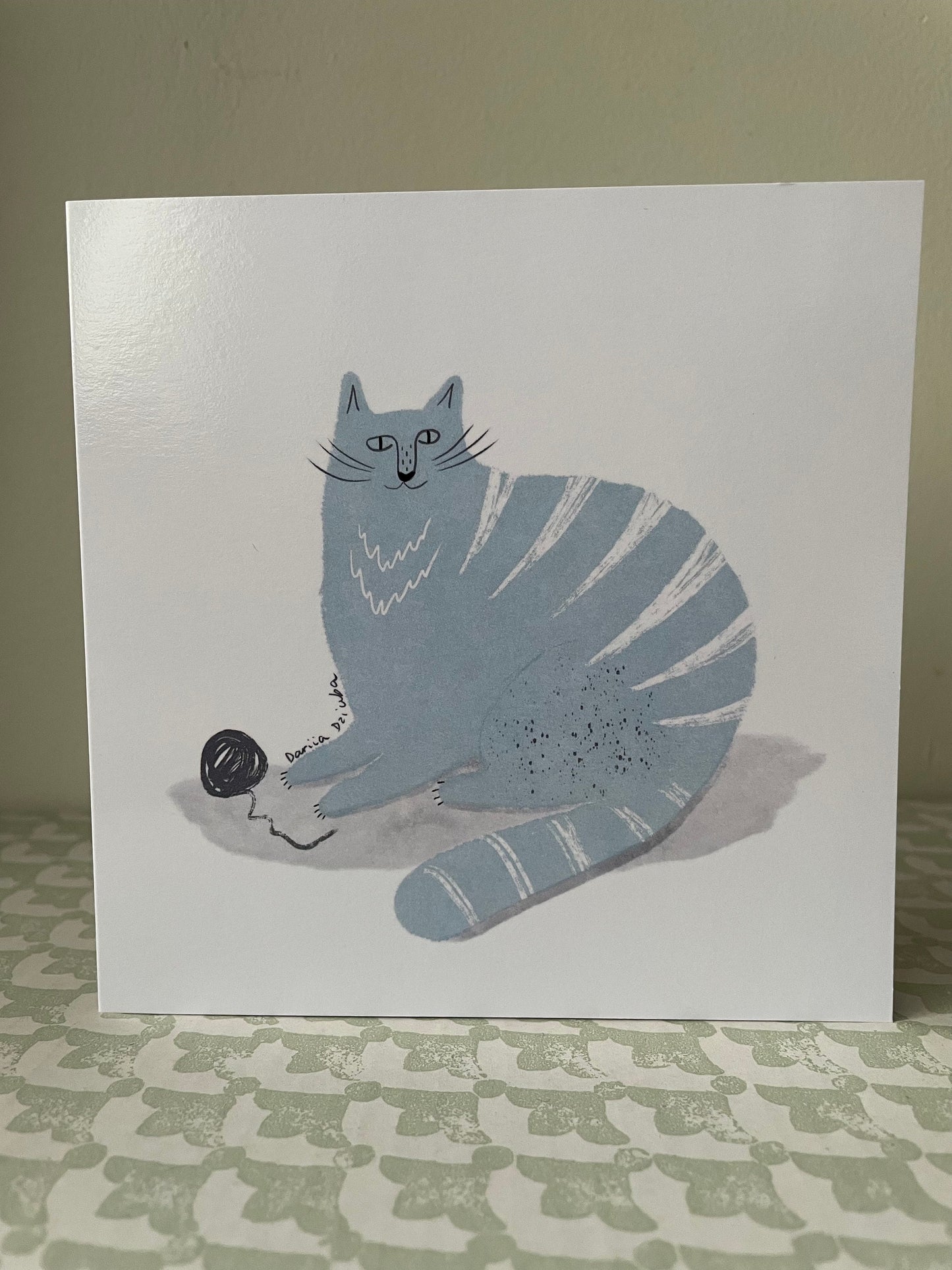Square Greeting card: Blue cat with ball of yarn