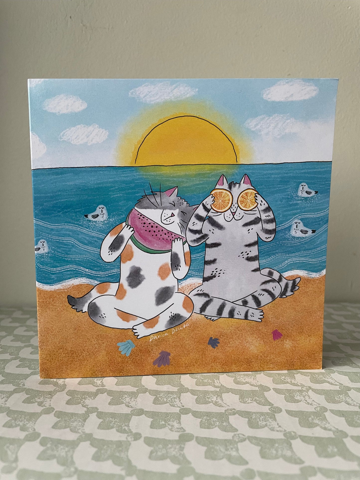 Cat friends at a beach: Greeting card