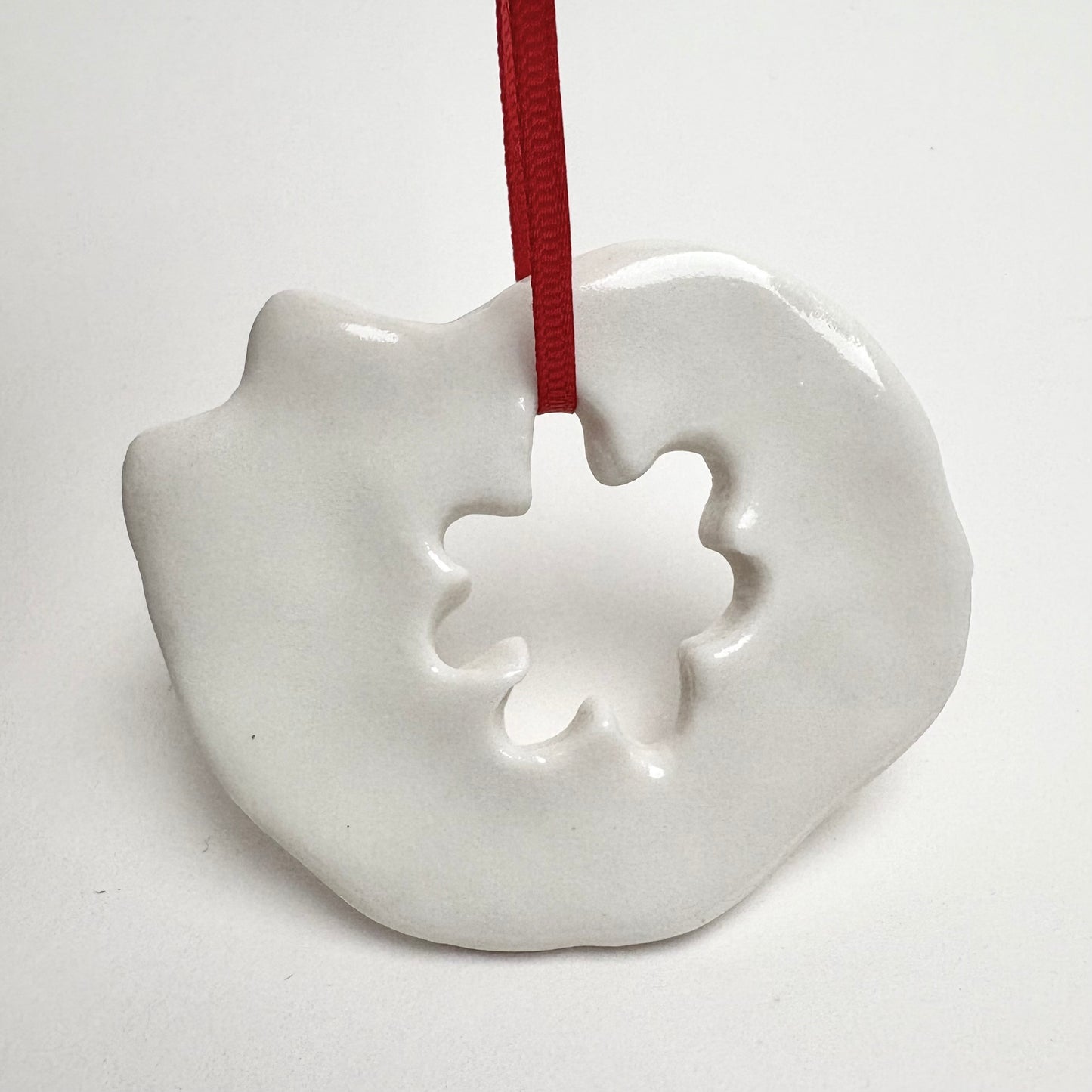 Handmade Porcelain Cat Christmas Ornament with Cutout, White Glazed Ceramic Holiday Decoration with Red Ribbon, Minimalist Winter Decor