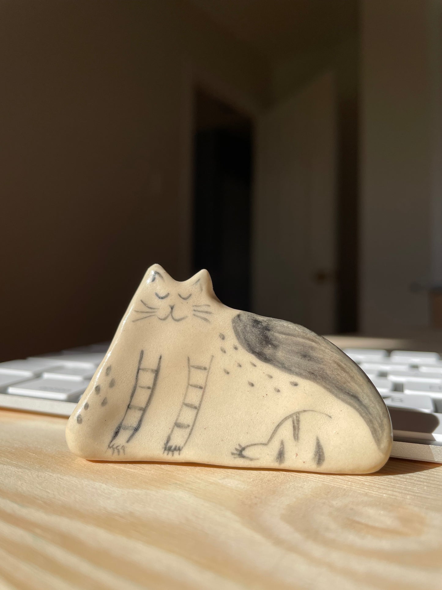 Black and white sitting kitty: Handmade ceramic cat figurine