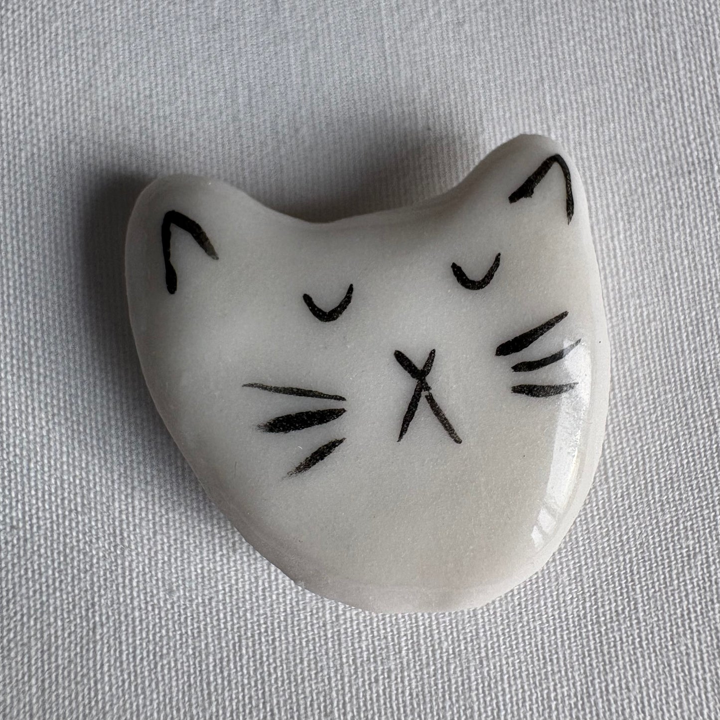 Tiny porcelain white kitty head magnets