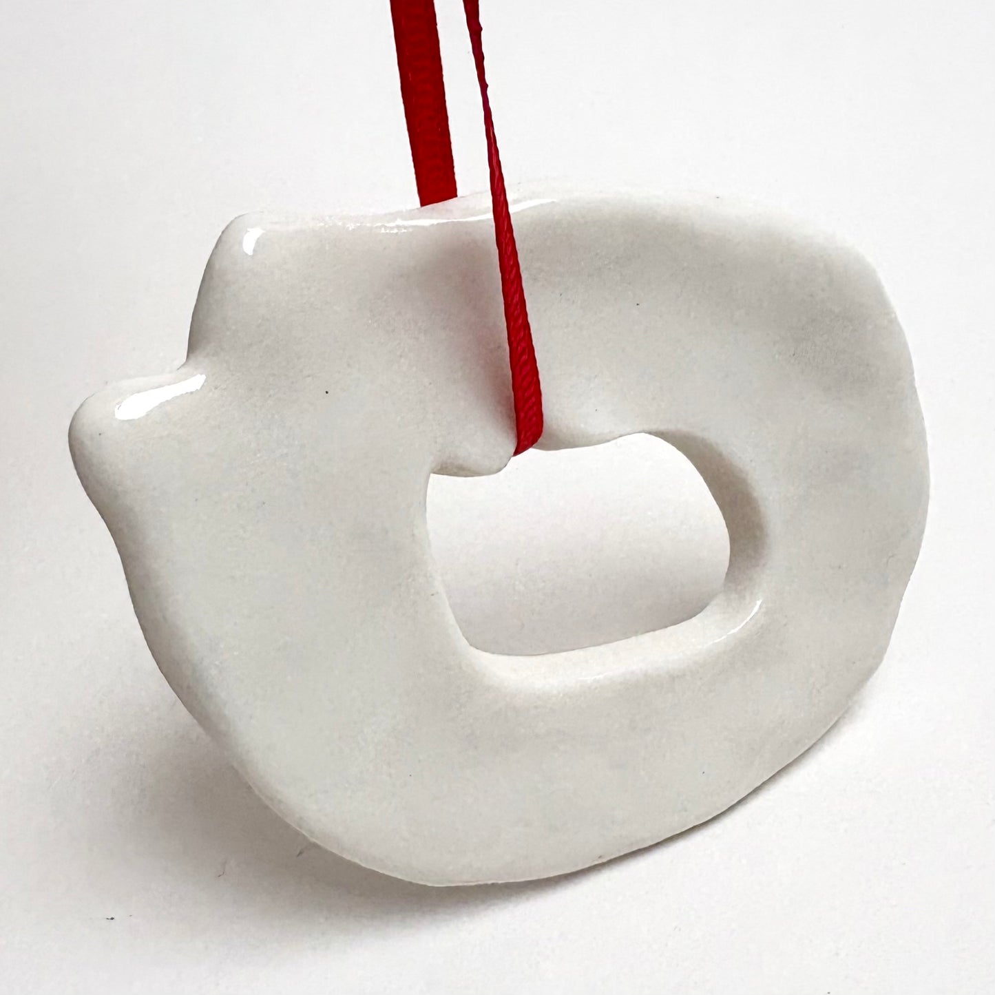 Handmade Porcelain Cat Christmas Ornament with Cutout, White Glazed Ceramic Holiday Decoration with Red Ribbon, Minimalist Winter Decor