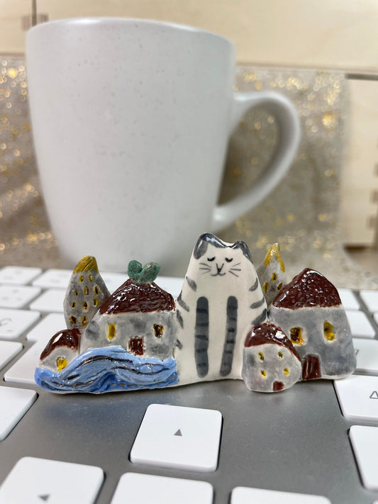 Cat among houses: Handmade ceramic cat figurine