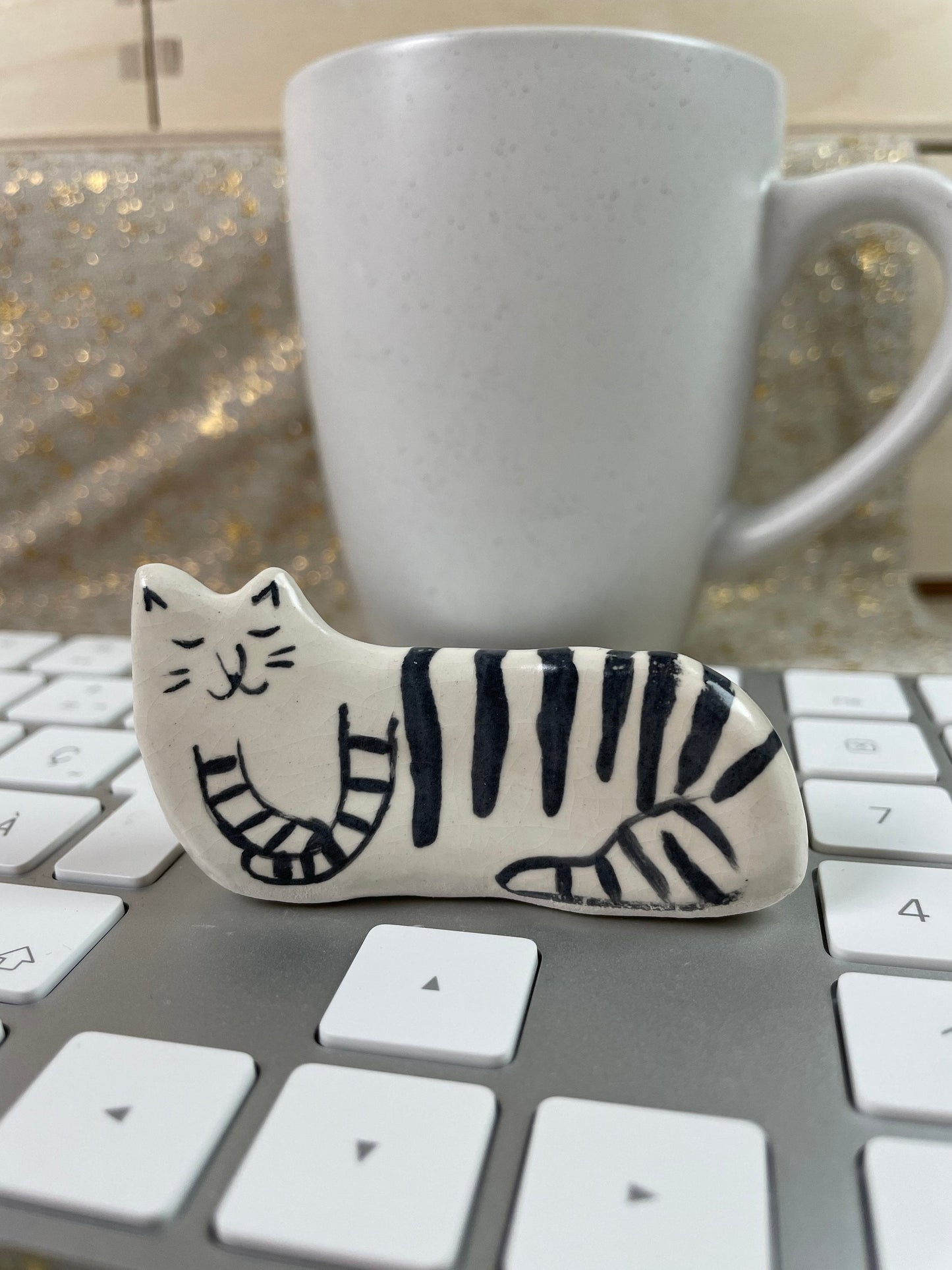 Cat with black stripes on the side: Handmade ceramic cat figurine