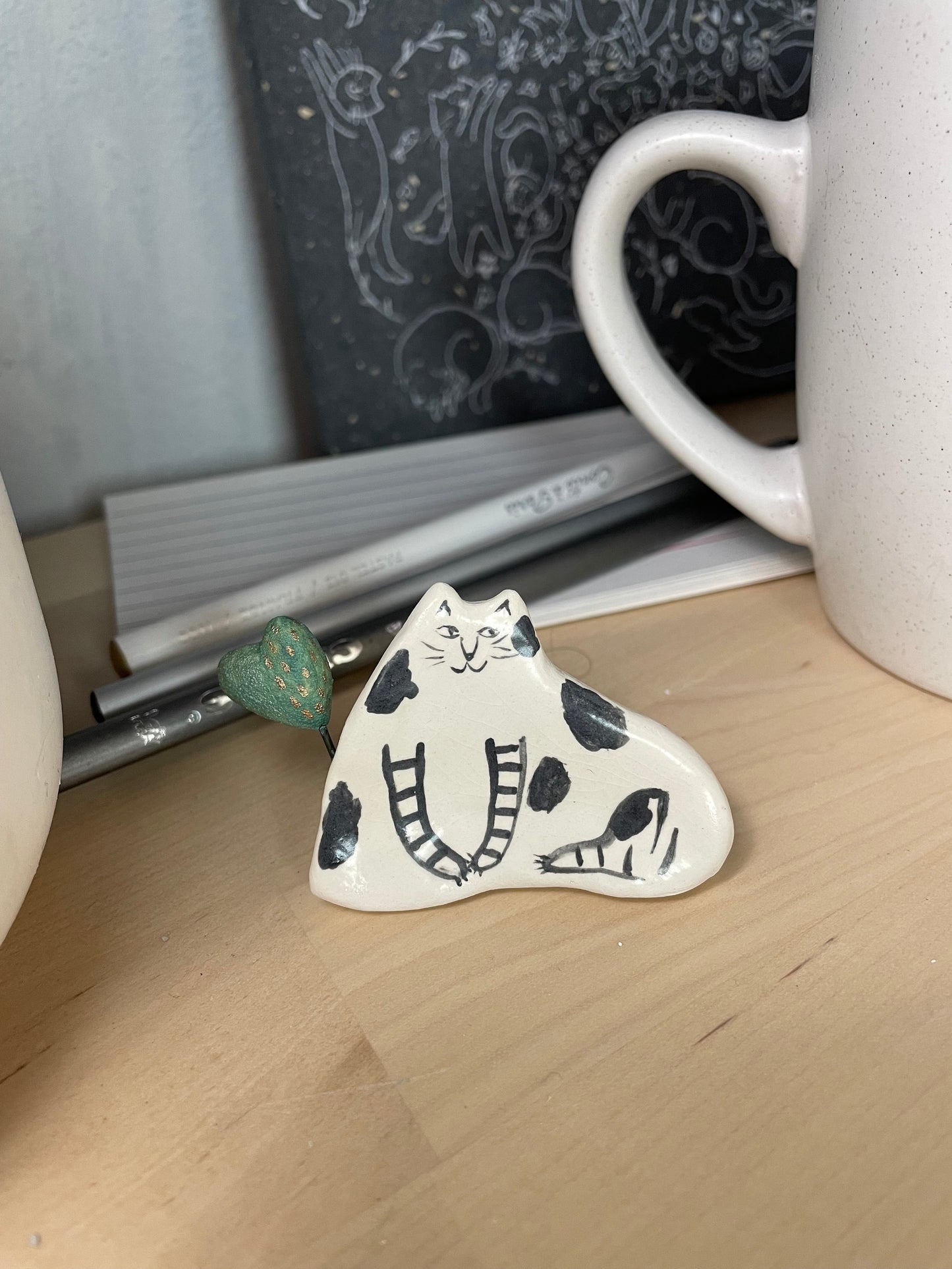 Cat and heart: Handmade ceramic cat figurine