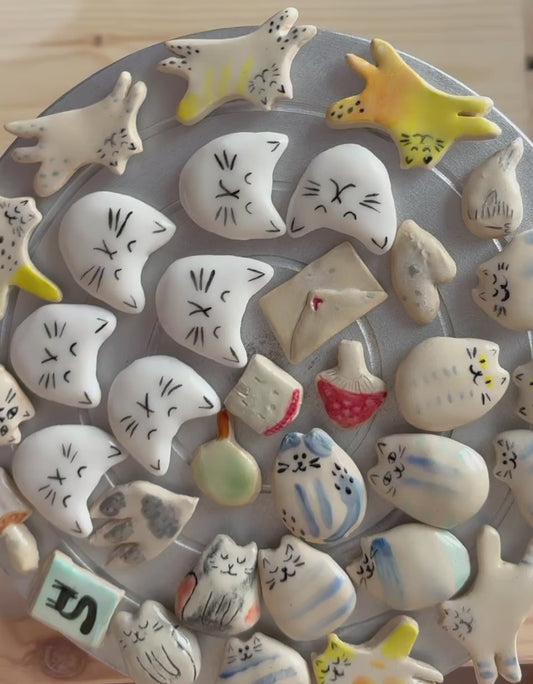 Tiny porcelain white kitty head magnets