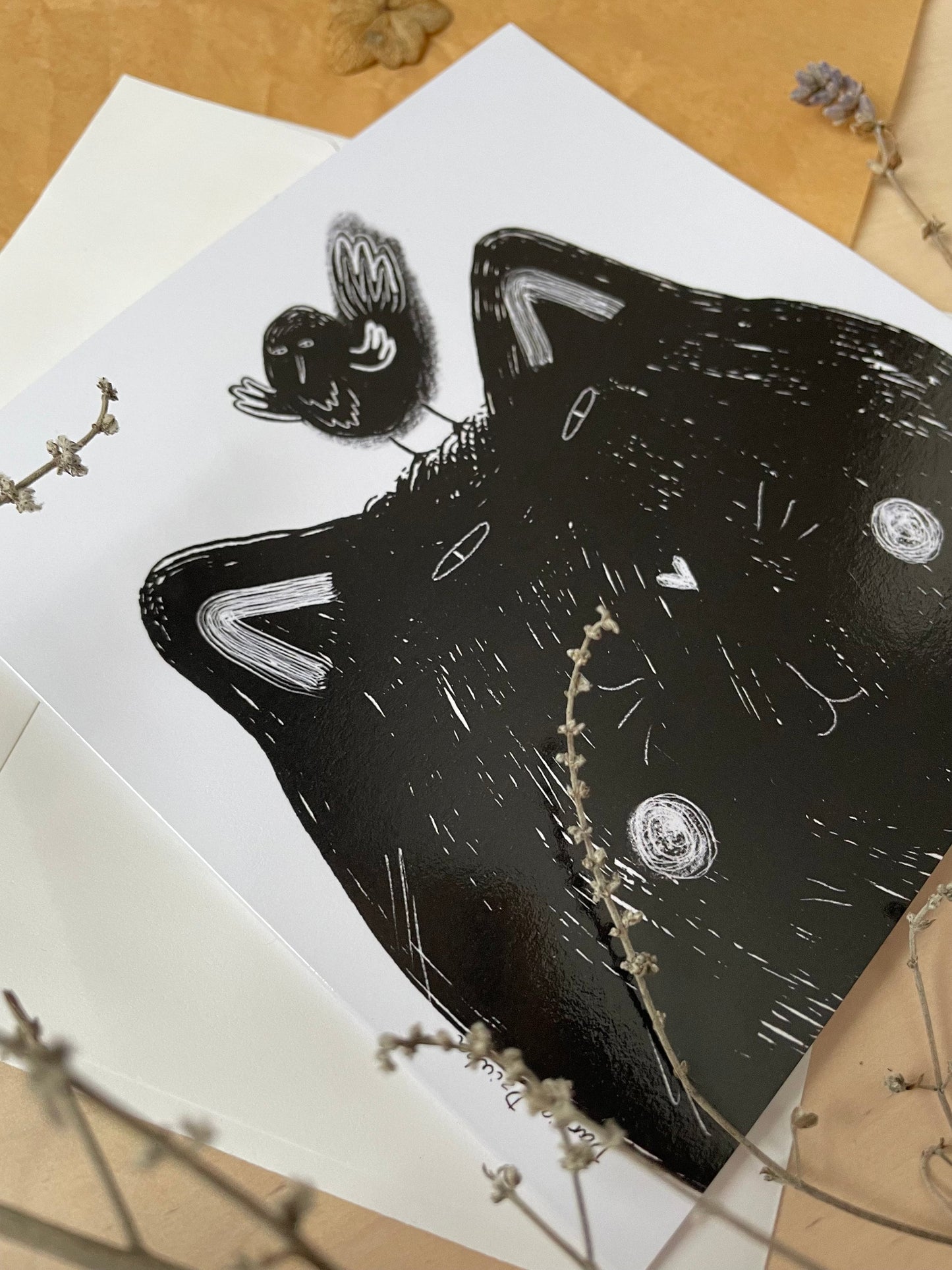 Black cat with black bird: Greeting card