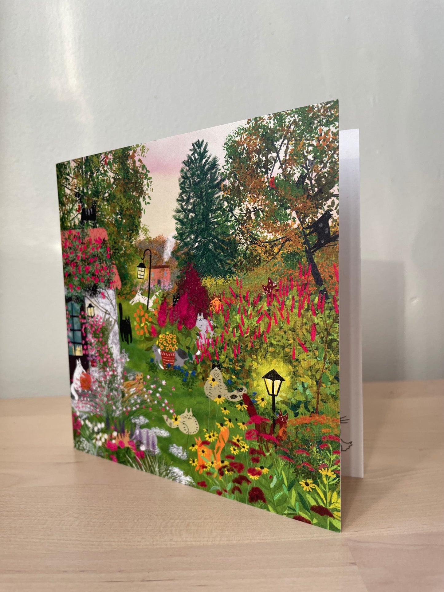 Cats in a fall garden: Greeting card