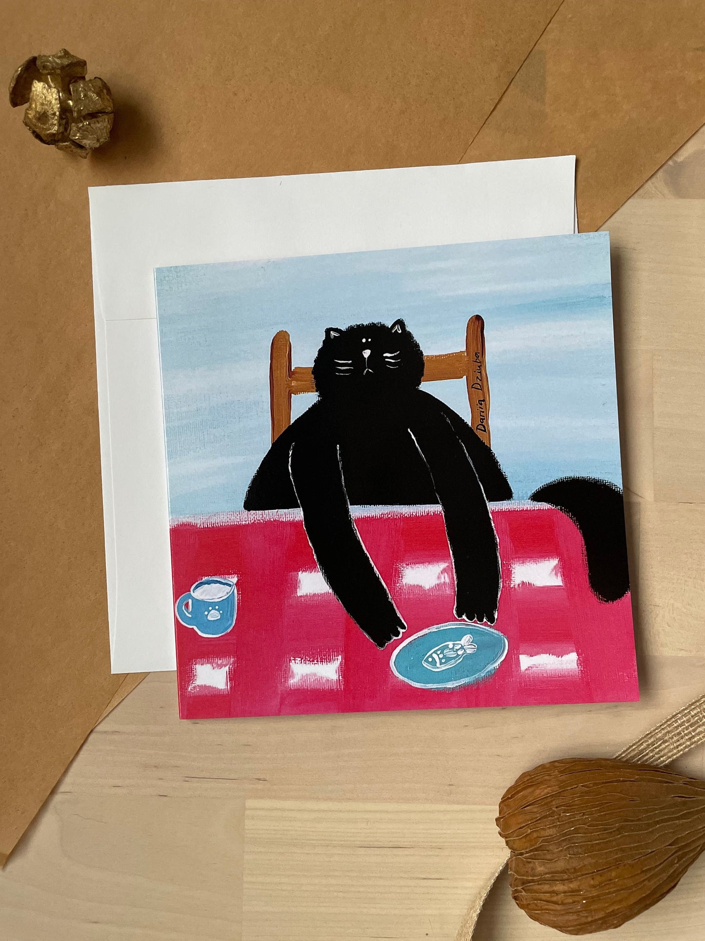 Black cat at a table: Greeting card