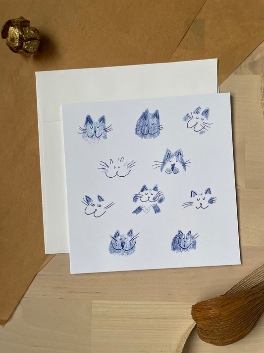 Blue cat heads: Greeting card